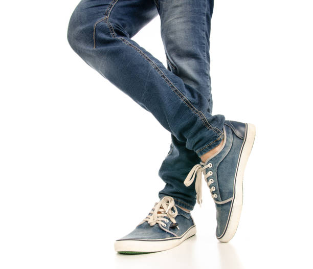istock Man legs feet jeans sneakers 1078032096