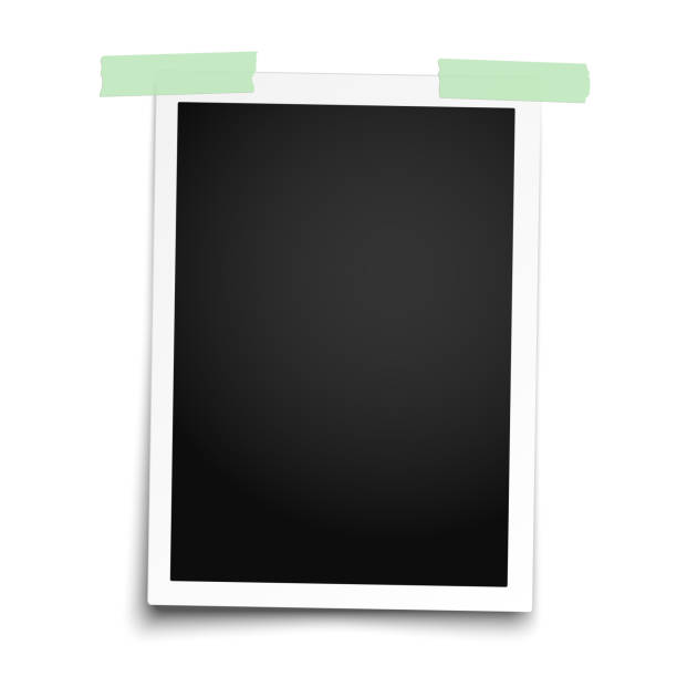 istock Realistic photo frame with straight edges placed vertically on white wall by two pieces of green adhesive tape. Vector template photo design. 1078032554