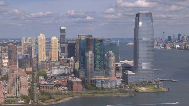 istock AERIAL: Flying around New Jersey downtown skyscrapers overlooking NY Manhattan 1078044032