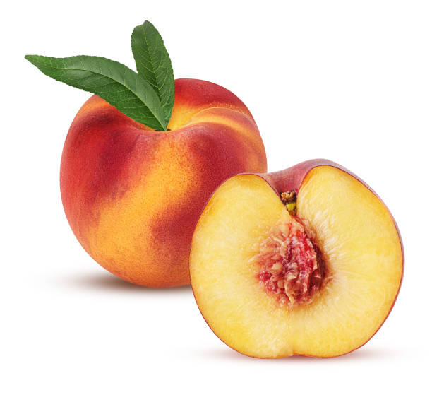 istock Ripe peach fruit and one cut in half with bone and leaf 1078044264