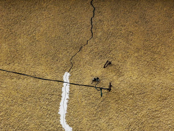 istock cracked exterior wall with stucco texture needing repair 1078048892
