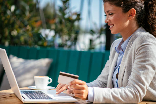 istock Beautiful young woman purchasing online 1078053660