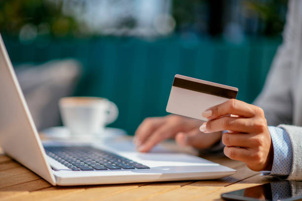 istock Beautiful young woman purchasing online 1078054098