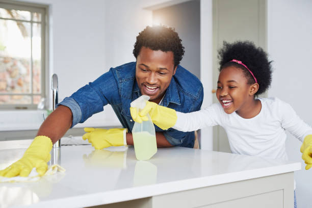 Together we won't miss a spot! Shot of a little girl and her father enjoying their chores at home lens flare offspring daughter human age stock pictures, royalty-free photos & images