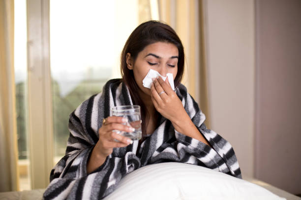 istock Sick woman relaxing on bed 1078064876