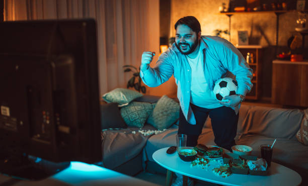 istock Man watching a football match 1078071120