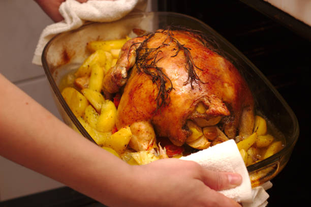 istock baked chicken with a crispy crust on a baking sheet in a dark oven 1078071730
