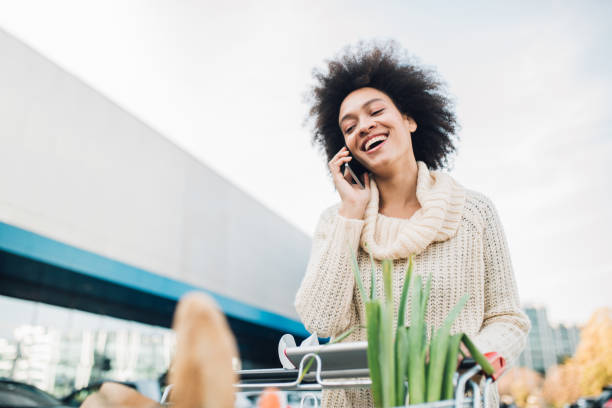 istock Smiling woman talking on phone 1078076190