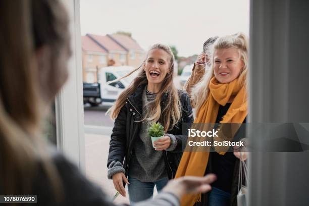 Greeting Guests At Housewarming Party Stock Photo - Download Image Now - Neighbor, Friendship, Greeting