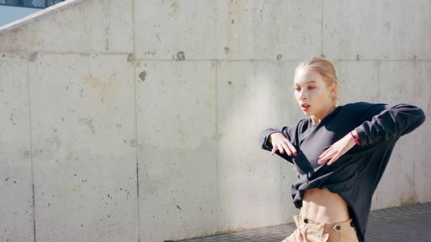 istock Girl Performs Modern Hip Hop Dance on the Streets 1078078578