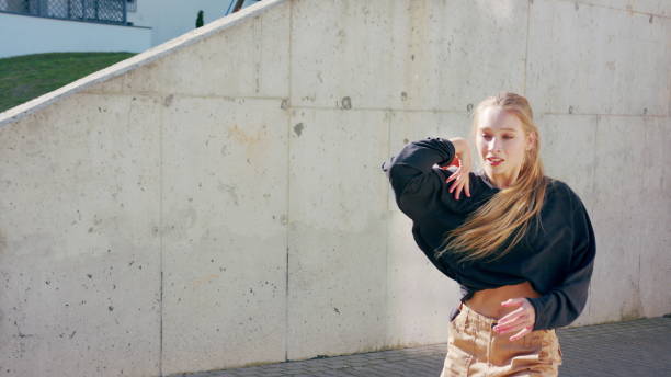 istock Girl Performs Modern Hip Hop Dance on the Streets 1078078632