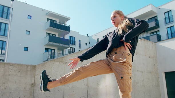 istock Girl Performs Modern Hip Hop Dance on the Streets 1078078652