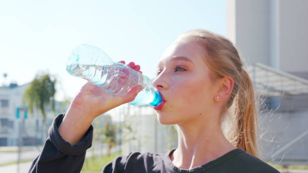 istock An Athlete Dancing Girl Drinking Water 1078078672