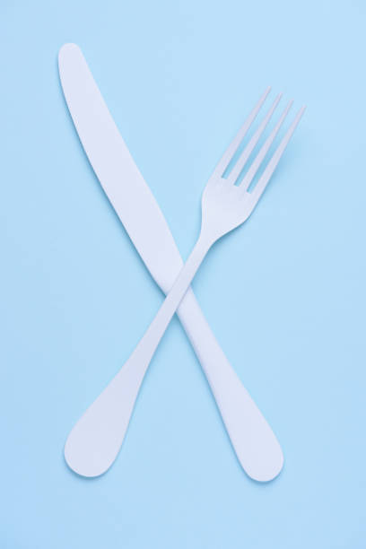 istock Crossed knife and fork symbol concept 1078079646