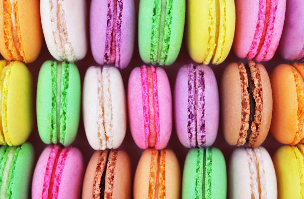 Colorful macarons on bright festive background