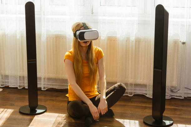 istock Girl wearing virtual reality goggles at home 1078082232