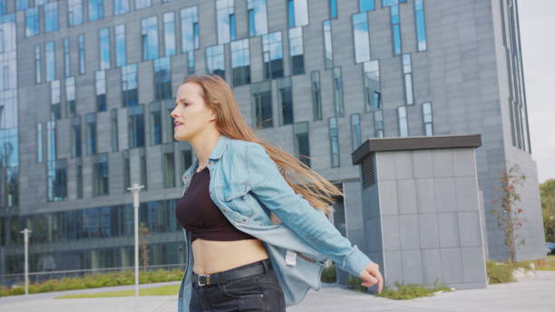 istock Young Woman Dancing Outside 1078083962