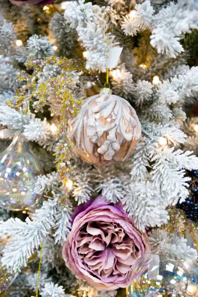 christmas decorated fir snowy tree, vertical closeup shot