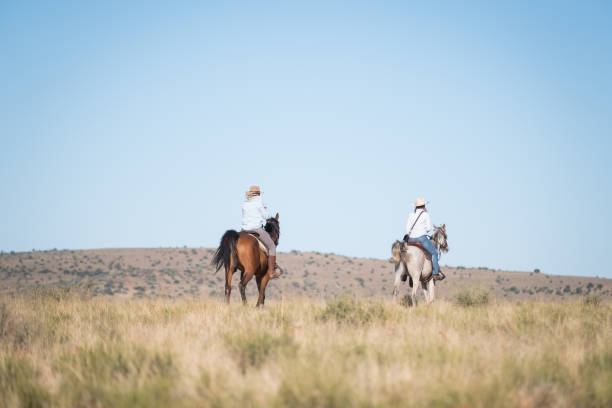 istock Cowgirls riding their horses 1078099676