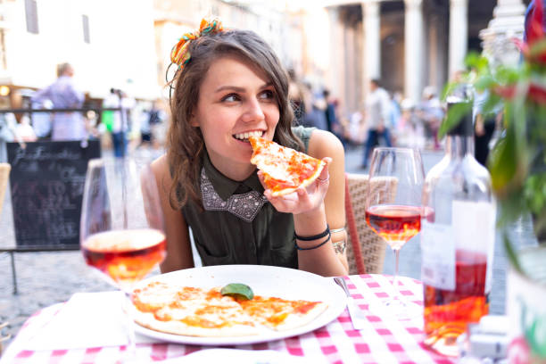 istock Attractive young woman having meal in Rome 1078101734
