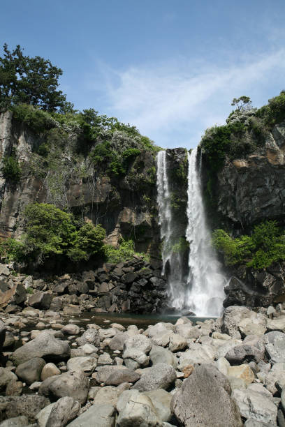 istock Famous Jeongbang Waterfall in Jeju, Korea 1078102676