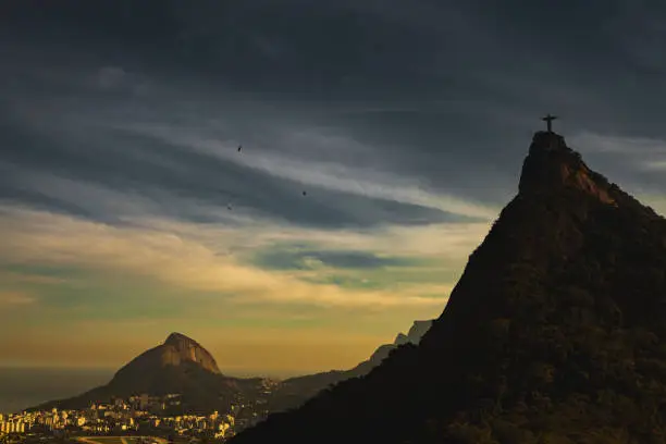 Sunset at Rio de Janeiro with Christ Redeemer in the foreground and the city in the background