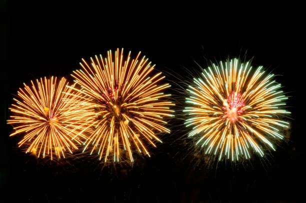 istock Gold and green salutes fireworks on black background 1078111422