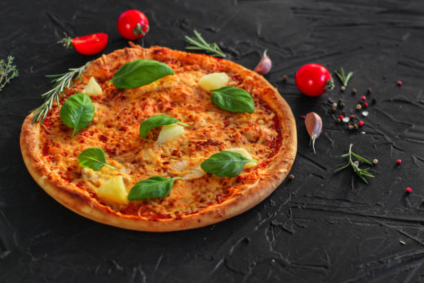 pizza, pineapples, chicken, tomato sauce, vegetables, basil (pizza ingredients). food background. copy space