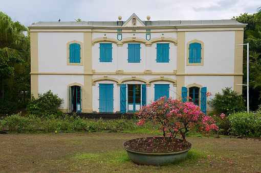 Saint-Gilles-les-Bains, Reunion - December 12, 2010: Exterior of the old colonial building of the Museum of Villele in Saint-Gilles-les-Bains, Reunion island.