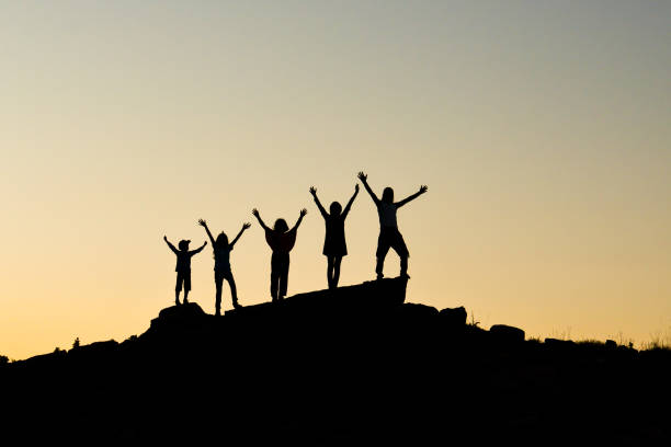 istock family mountaineering success 1078116094