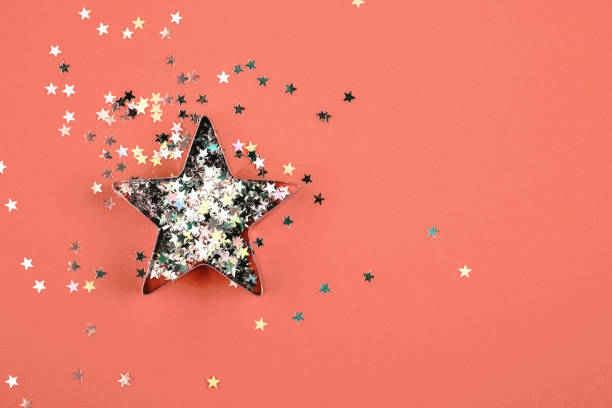 istock Star with sparkles on Living Coral background. 1078117074