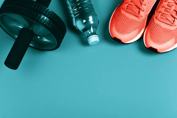 Living Coral sneakers on blue background.