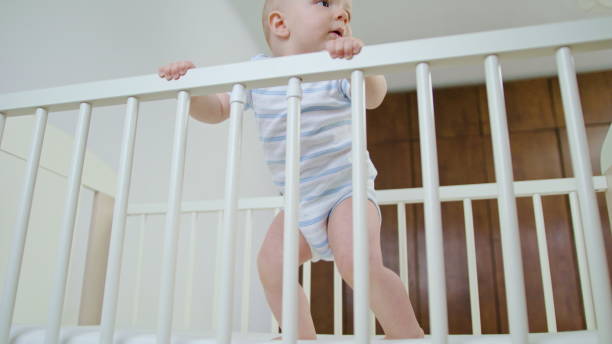 istock Cute Baby Playing in her Crib at Home 1078119638