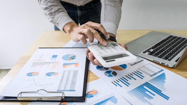 istock Businessman accountant working audit and calculating expense financial data on graph documents, doing finance in workplace 1078121322