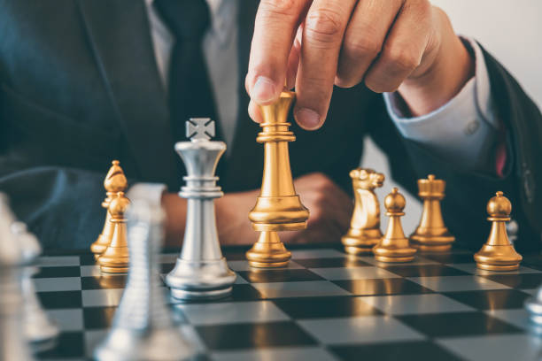 istock Businessman leadership playing chess and thinking strategy plan about crash overthrow the opposite team and development analyze for successful of corporate 1078121462