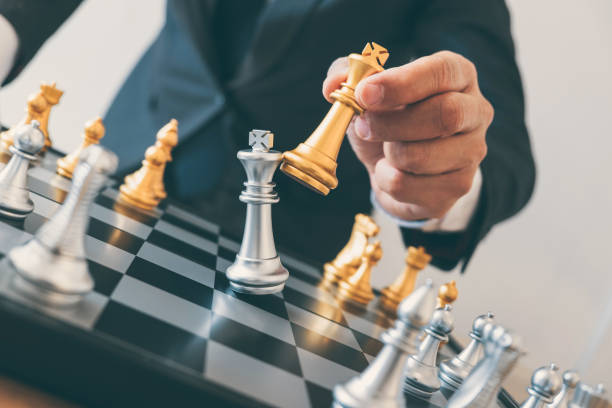 istock Businessman leadership playing chess and thinking strategy plan about crash overthrow the opposite team and development analyze for successful of corporate 1078121478