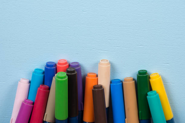 pen tip pens on blue background and with space for text.