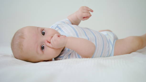 istock Cute Baby Lying in Her Bed at Home 1078122672
