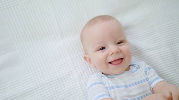 istock Cute Baby Lying in Her Bed at Home 1078122808