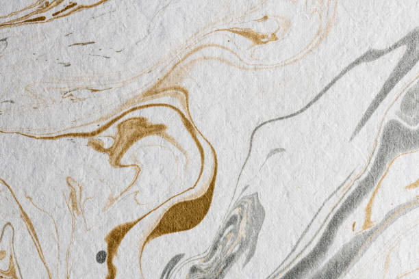 istock marble ink paper texture gold gray white 1078127612