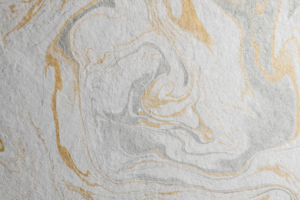 istock marble ink paper texture gold gray white 1078127616