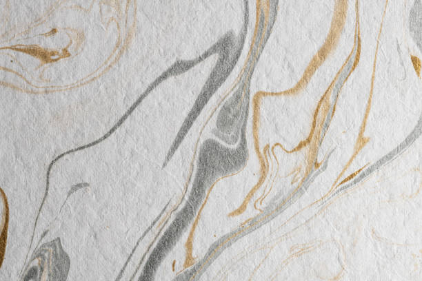 istock marble ink paper texture gold gray white 1078127678