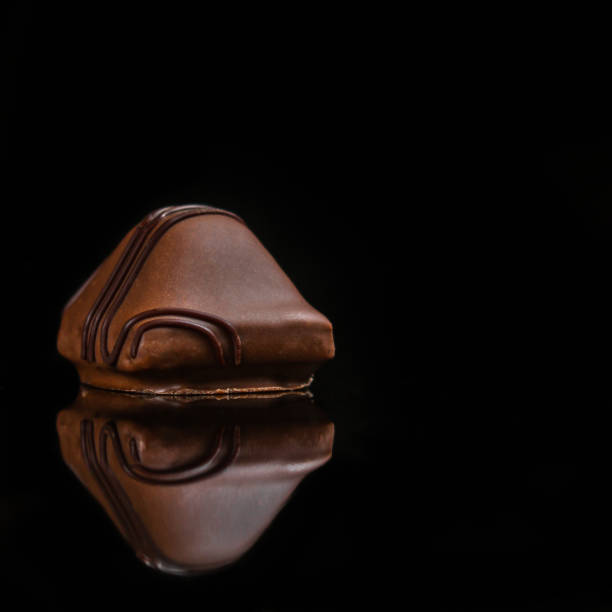 istock candy, chocolate, filler, cream, coffee  (Black background). food background. copy space 1078131392