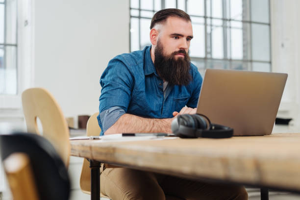 istock Serious businessman concentrating on his work 1078131400