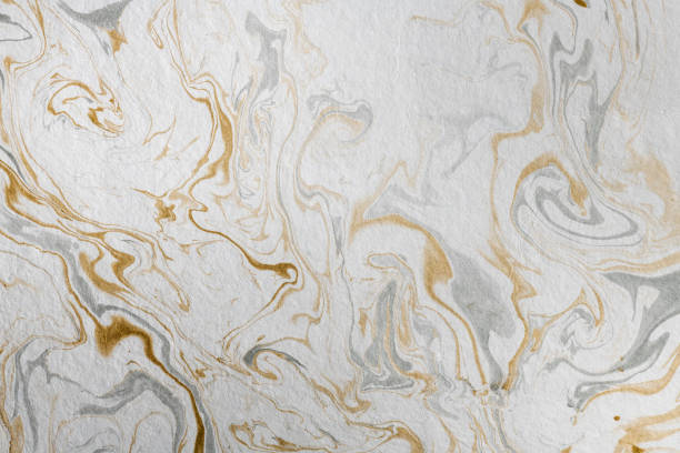 istock marble ink paper texture gold gray white 1078133732