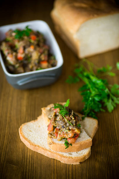 istock eggplant caviar with tomatoes and a slice of bread 1078136664