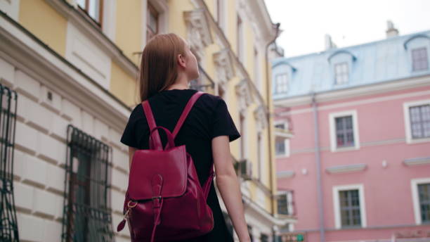 istock Young Redhead Lady Walking in Town 1078138166