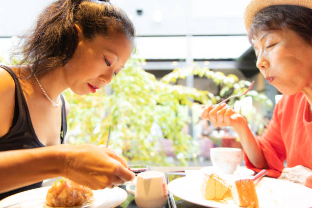 istock Two people enjoying coffee and cake 1078139412