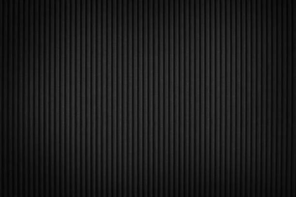 istock Black corrugated cardboard texture and background with vignette 1078141246