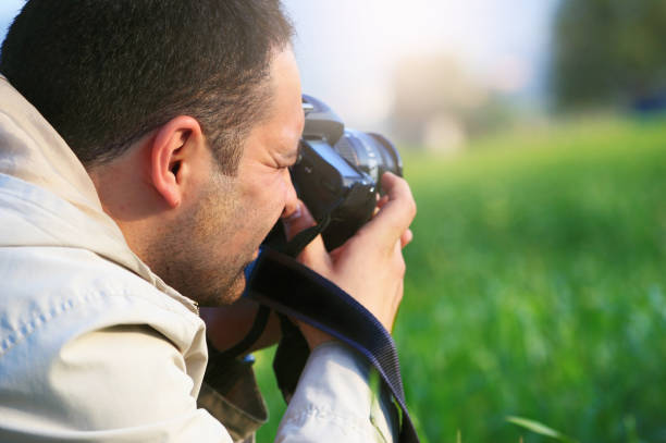 istock Photographer is working on the grasses 1078143060